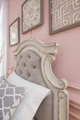 Realyn Queen Upholstery Panel Bed, Dresser, Chest, Nightstand, and Vanity Set